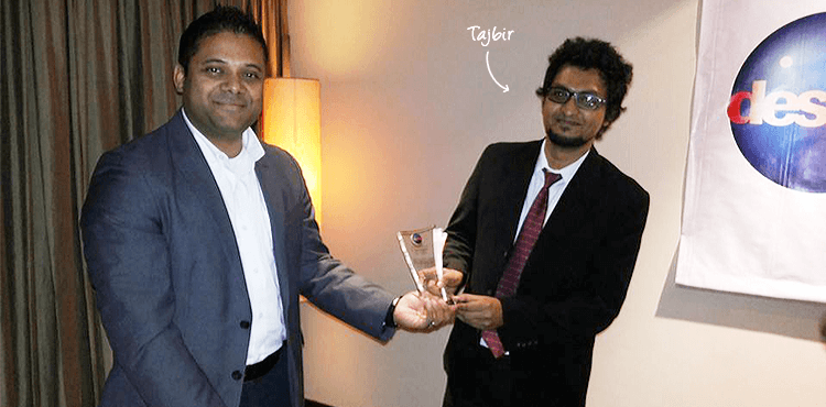 Sk. Tajbir receiving Employee of the Year 2013 award from Desme's CEO Enam Noor